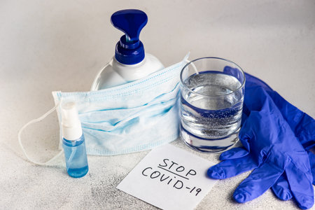 COVID-19 virus concept with antibacterial soap on concrete background with copy spaceの写真素材