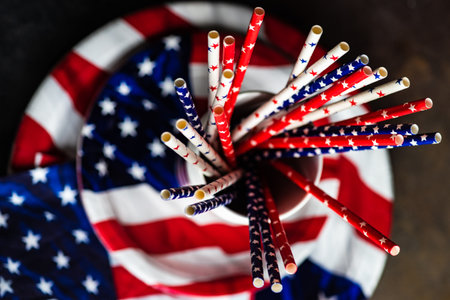 Table setting concept with 4th of July or USA Independence Day with flags on concrete background...