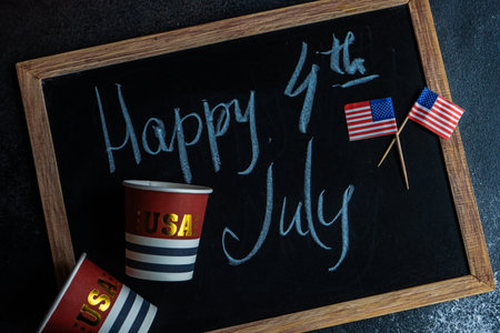 Table setting concept with 4th of July or USA Independence Day with flags on concrete background with copy spaceの写真素材
