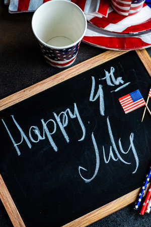 Table setting concept with 4th of July or USA Independence Day with flags on concrete background with copy spaceの写真素材