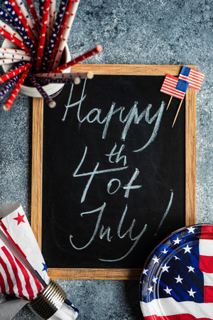Table setting concept with 4th of July or USA Independence Day with flags on concrete background with copy spaceの写真素材