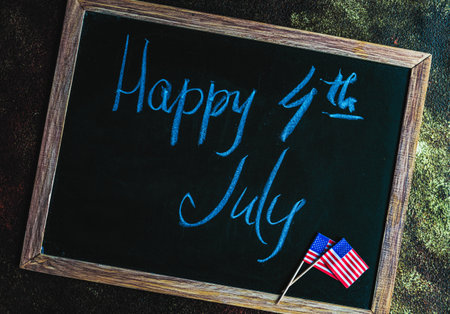 Table setting concept with 4th of July or USA Independence Day with flags on concrete background with copy spaceの写真素材