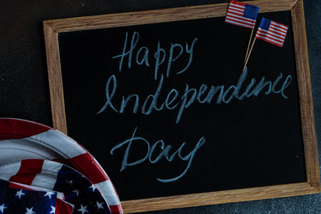 Table setting concept with 4th of July or USA Independence Day with flags on concrete background with copy spaceの写真素材