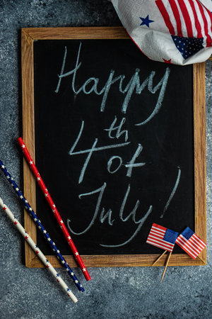 Table setting concept with 4th of July or USA Independence Day with flags on concrete background with copy spaceの写真素材