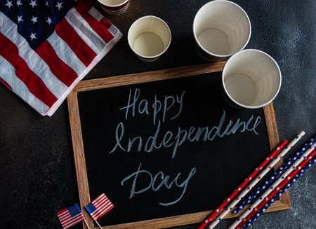 Table setting concept with 4th of July or USA Independence Day with flags on concrete background with copy spaceの写真素材