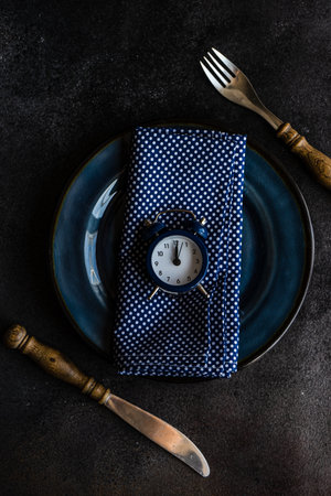 Empty bowl as a table setting concept on stone background with copy spaceの写真素材