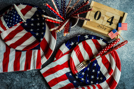 Table setting for celebration of 4th July or Independence day of USA on grey concrete background with copy spaceの写真素材