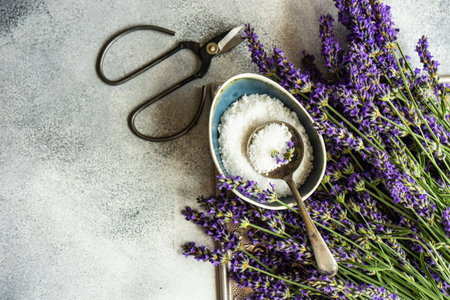 Healthcare concept with fresh lavender flowers and sea salt on stone background with copy spaceの写真素材