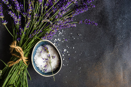 Healthcare concept with fresh lavender flowers and sea salt on stone background with copy spaceの写真素材