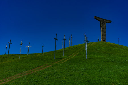 Famous Didgori battle monument with giant swards and sculptures of soldiers close to Tbilisi in Caucasus mountain range in summer time as a travel cardのeditorial素材