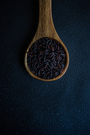 Organic black rice as a cooking ingredients on concrete background with copy spaceの写真素材