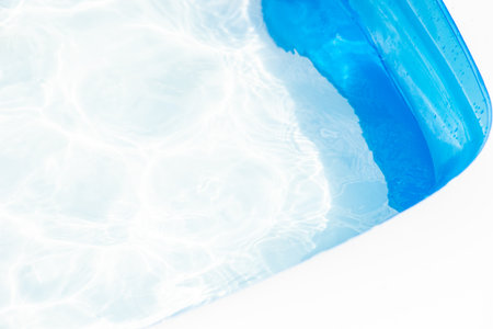 Summer rest concept with pool and water in sunny dayの写真素材