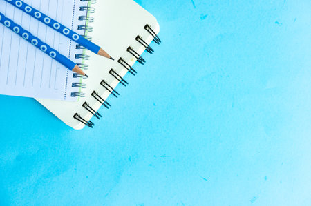 Back to School flatlay on blue background with copy spaceの写真素材