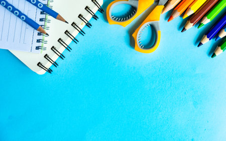 Back to School flatlay on blue background with copy spaceの写真素材