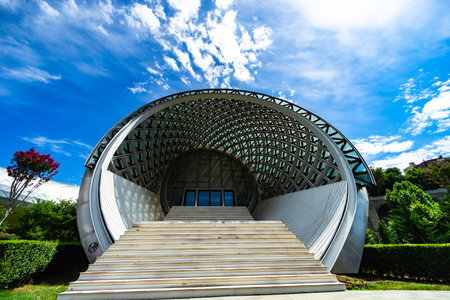 14 JULY 2020, TBILISI, GEORGIA: Famous Glass bridge of Peace and Rike Park in the Old town of Tbilisi in sunny day with bright blue skyの写真素材