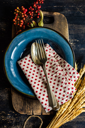Thanksgiving day or autumnal harvest concept with frame with nuts, berries, vegetable and fruits on...