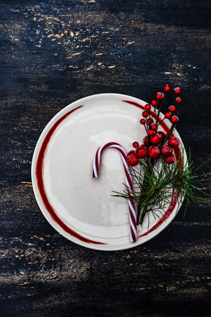 Table setting on vintage and rustic wooden background with cutkery decorated with ribbonの写真素材
