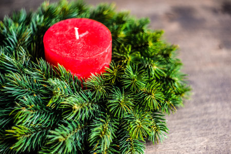 Christmas holiday flatlay with evergreen wreath on wooden background with copy spaceの写真素材