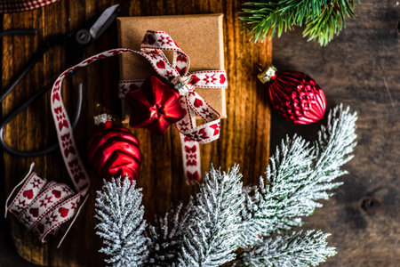 Christmas card concept with gift boxes decorated with ribbon and baublesの写真素材