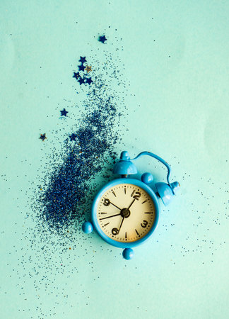 Christmas card concept with clock on minimalistic backgroundの写真素材