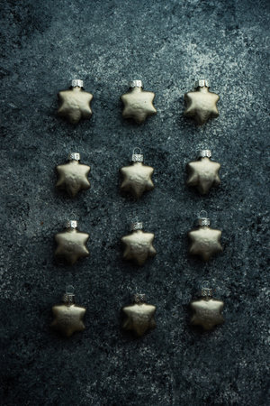 Christmas frame or flat lay concept with festive baubles on concrete background