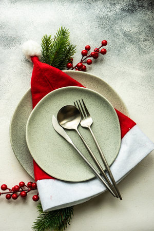 Festive place setting for celebration the Christmas eve on concrete tableの写真素材