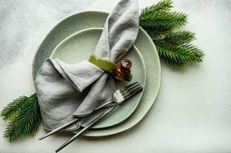 Festive place setting for celebration the Christmas eve on concrete tableの写真素材