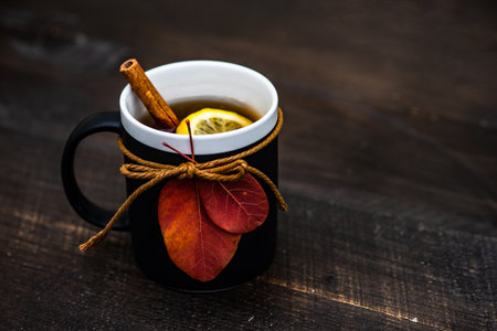 Cup of black tea and lemon on wooden background with copy spaceの写真素材