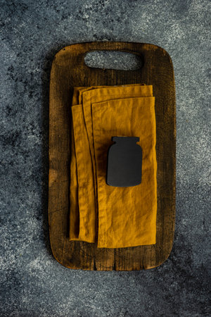 Cooking concept with rustic wooden board and kitchen stuff on grey concrete backgroundの写真素材