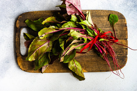 Fresh organic beetroot plant on concrete background with copy spaceの写真素材
