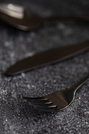 Cutlery set on stone background with copy spaceの写真素材