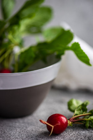 Organic fresh radish vegetable as a ingredient for salad cookingの写真素材