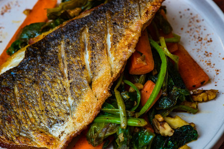 Grilled salmon fish and vegetable served on plate