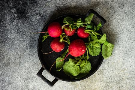 Cooking concept with organic reddish vegetables in metal pan