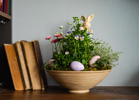 Easter floral composition with spring flowers and colored eggsの写真素材