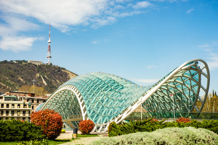 17 APRIL 2021, TBILISI, GEORGIA: Rike park and famous glass  Peace bridge in Tbilisi's downtown,...