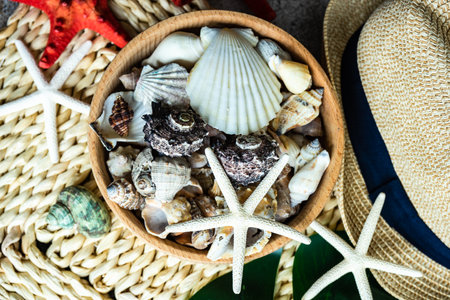 Summer background flat lay with straw hat and sea stars