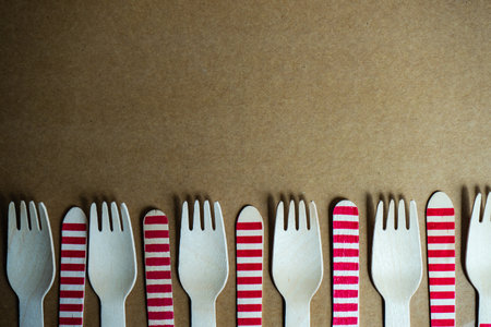 Summer background with wooden recycling cutlery on paper backgroundの写真素材