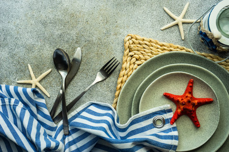 Marine table setting on concrete table as a summer background conceptの写真素材
