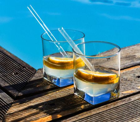 Gin and tonic cocktail on poolside barの写真素材