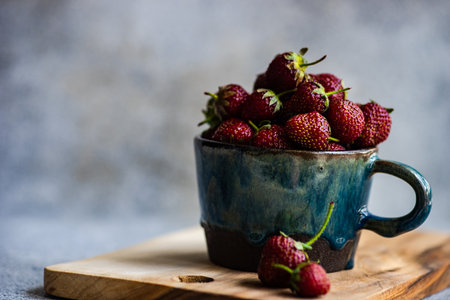 Summer background with ripe strawberries on concrete backgroundの写真素材