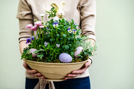 Woman florist hands with Easter spring composition