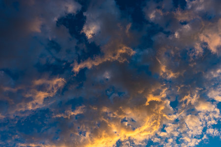 Summer background with moody blue and red sunrising sky