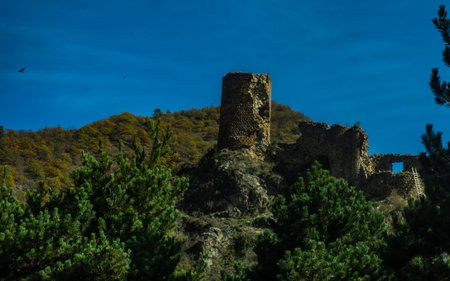 Ruins of medieval castle on the hilltop of Caucasus mountains in Borjomi gorge in Georgia