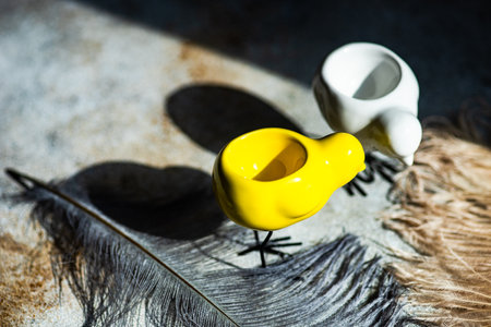 Easter holiday card concept with egg holden in shape of chichen with deep shadowsの写真素材