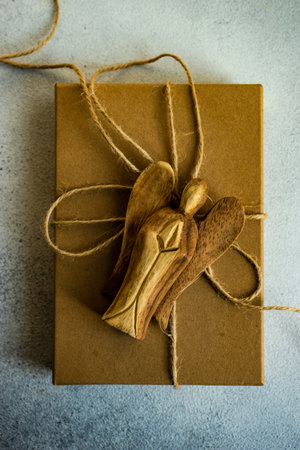 Holiday card concept with gift boxes and ribbon on concrete backgroundの写真素材