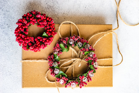 Holiday card concept with gift boxes and ribbon on concrete backgroundの写真素材