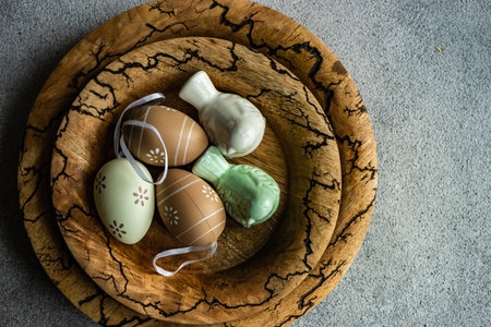 Easter dinner table settinf with colored eggs served on the table