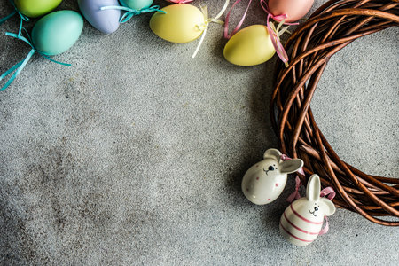 Easter colored eggs with ornaments on wooden backgroundの写真素材