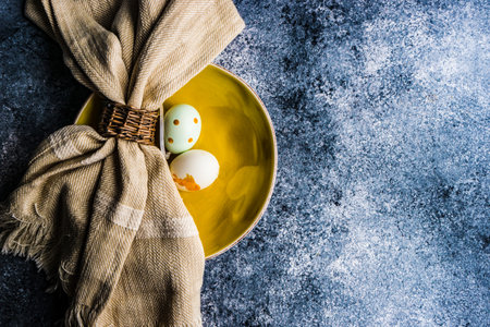 Easter minimalistic place setting on concrete backgroundの写真素材